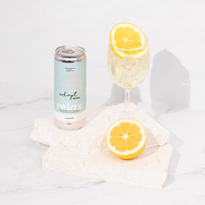 sparkling adaptogenic drinks - lemon myrtle poured into glass with slice of lemon